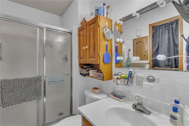 full bath featuring vanity, toilet, and a stall shower