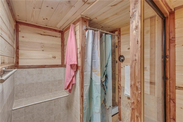 full bathroom with wood ceiling and a shower with shower curtain