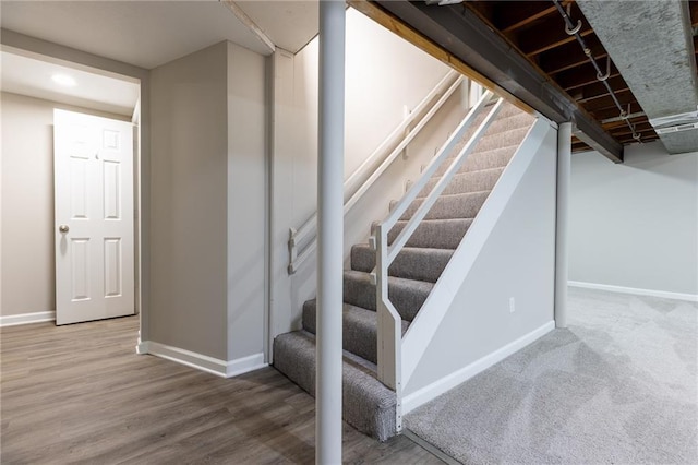 stairs featuring baseboards, recessed lighting, and wood finished floors