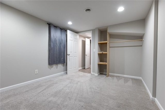 unfurnished bedroom featuring carpet floors, recessed lighting, baseboards, and visible vents