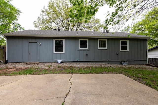 rear view of house with a patio and board and batten siding