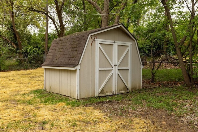 view of shed with fence