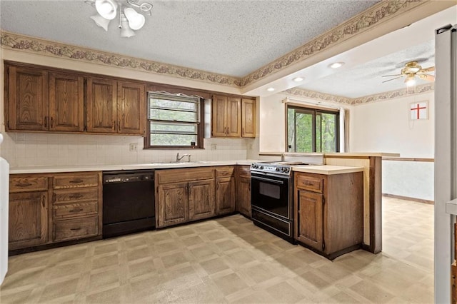 kitchen featuring a ceiling fan, electric range, a peninsula, and dishwasher