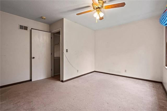 unfurnished bedroom with carpet floors, baseboards, and visible vents