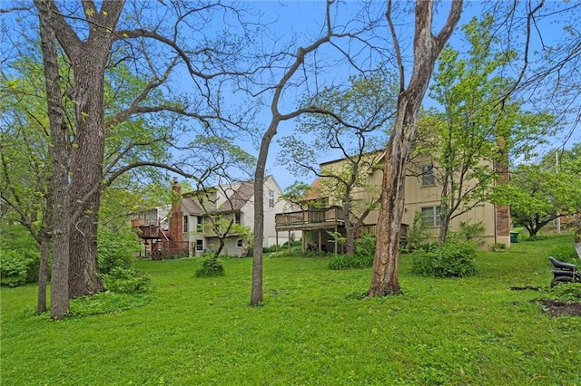 view of yard featuring a wooden deck