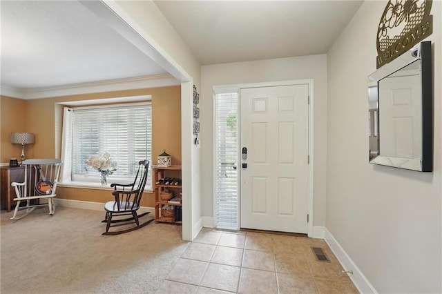 22721 E 27th Street Ct S, Blue Springs, MO 64015 - entryway featuring baseboards, crown molding, and light tile patterned floors