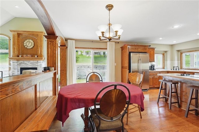 22721 E 27th Street Ct S, Blue Springs, MO 64015 - dining room featuring plenty of natural light, a chandelier, light wood-type flooring, recessed lighting, and vaulted ceiling