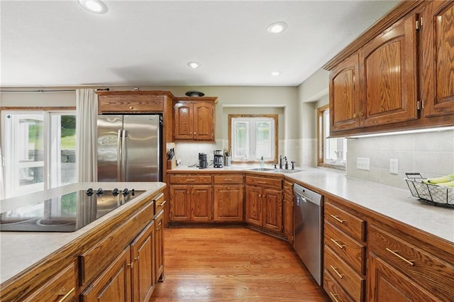 22721 E 27th Street Ct S, Blue Springs, MO 64015 - kitchen with appliances with stainless steel finishes, a sink, light countertops, and recessed lighting