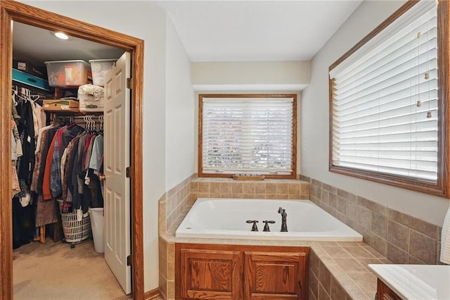 22721 E 27th Street Ct S, Blue Springs, MO 64015 - full bathroom with healthy amount of natural light, a garden tub, and a walk in closet