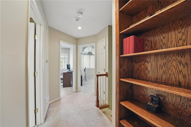 22721 E 27th Street Ct S, Blue Springs, MO 64015 - hallway featuring an upstairs landing, light carpet, and baseboards