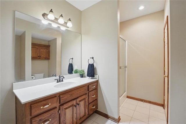 22721 E 27th Street Ct S, Blue Springs, MO 64015 - bathroom with a stall shower, vanity, baseboards, and tile patterned flooring