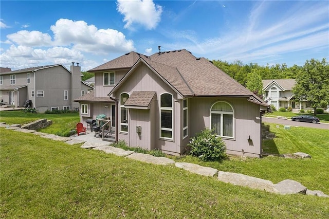 22721 E 27th Street Ct S, Blue Springs, MO 64015 - rear view of house featuring a patio area, a yard, and a shingled roof
