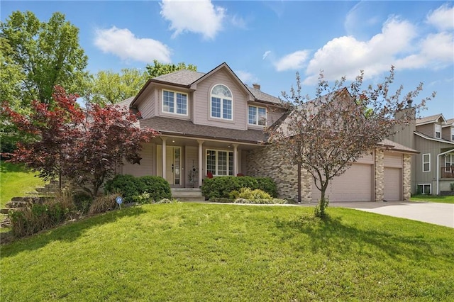 22721 E 27th Street Ct S, Blue Springs, MO 64015 - traditional-style home featuring a porch, an attached garage, concrete driveway, and a front lawn