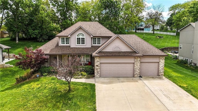 22721 E 27th Street Ct S, Blue Springs, MO 64015 - traditional-style house with concrete driveway, an attached garage, a front lawn, a shingled roof, and covered porch