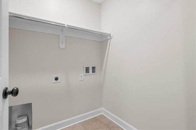 washroom featuring laundry area, light tile patterned flooring, baseboards, washer hookup, and hookup for an electric dryer