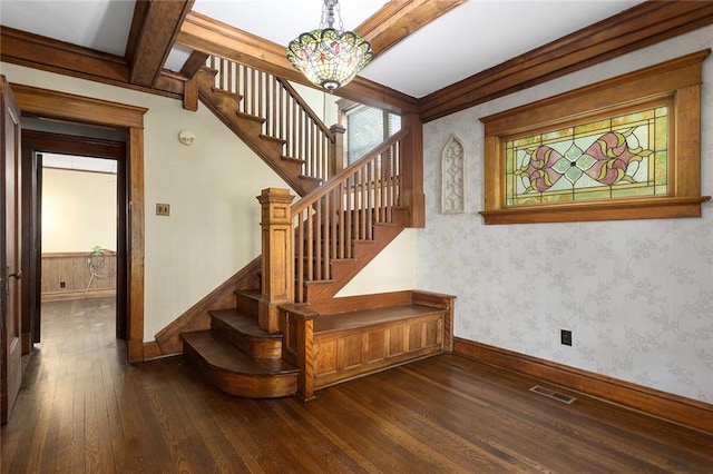 3700 Jefferson St, Kansas City, MO 64111 - staircase featuring hardwood / wood-style floors, baseboards, wallpapered walls, and beamed ceiling