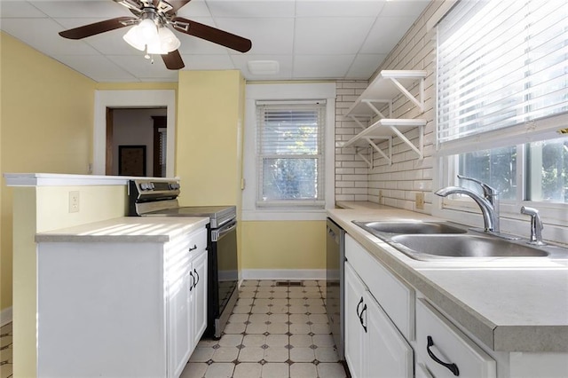 3700 Jefferson St, Kansas City, MO 64111 - kitchen featuring electric range, a sink, open shelves, baseboards, and dishwasher
