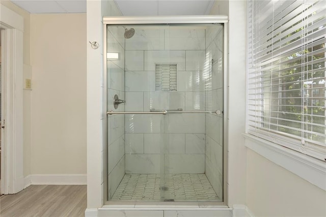 3700 Jefferson St, Kansas City, MO 64111 - full bath featuring wood finished floors, baseboards, and a shower stall