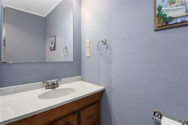 3700 Jefferson St, Kansas City, MO 64111 - bathroom with crown molding, vanity, and a textured wall