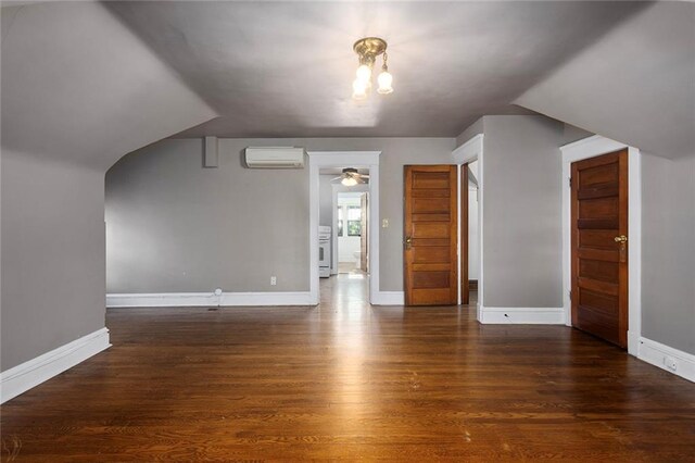 3700 Jefferson St, Kansas City, MO 64111 - bonus room with a wall mounted AC, wood finished floors, baseboards, and a ceiling fan
