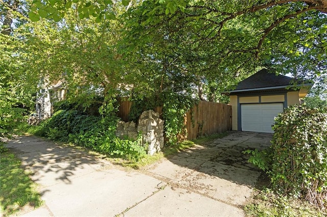 3700 Jefferson St, Kansas City, MO 64111 - garage featuring driveway and fence