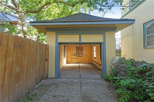 3700 Jefferson St, Kansas City, MO 64111 - view of side of property with stucco siding, fence, and roof with shingles
