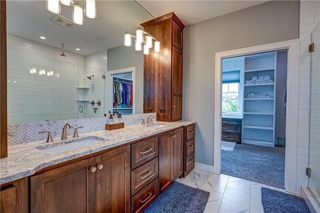18 Black Hawk Dr, Lake Winnebago, MO 64034 - bathroom with a shower stall, a spacious closet, double vanity, and baseboards