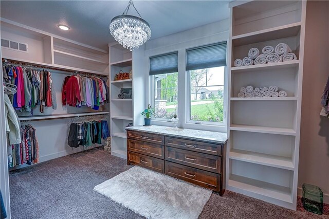 18 Black Hawk Dr, Lake Winnebago, MO 64034 - walk in closet featuring carpet and a chandelier