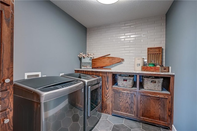 18 Black Hawk Dr, Lake Winnebago, MO 64034 - laundry area with separate washer and dryer, tile patterned floors, a textured ceiling, and a dry bar