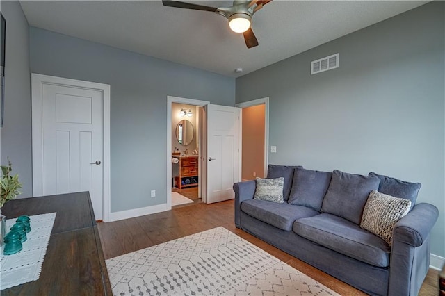 18 Black Hawk Dr, Lake Winnebago, MO 64034 - living room with ceiling fan, wood finished floors, and baseboards