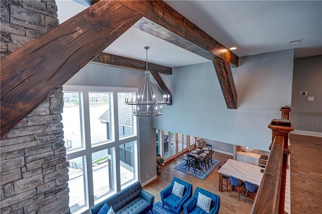 18 Black Hawk Dr, Lake Winnebago, MO 64034 - dining area with wood finished floors, a chandelier, and baseboards