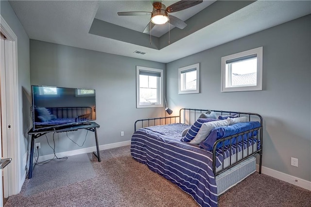 18 Black Hawk Dr, Lake Winnebago, MO 64034 - carpeted bedroom with a tray ceiling, baseboards, and ceiling fan