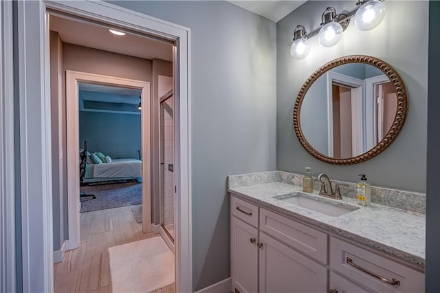 18 Black Hawk Dr, Lake Winnebago, MO 64034 - ensuite bathroom featuring vanity, a stall shower, and baseboards