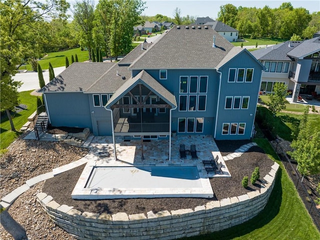 18 Black Hawk Dr, Lake Winnebago, MO 64034 - rear view of property featuring a patio and a shingled roof