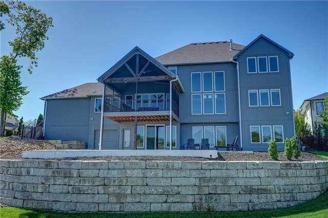 18 Black Hawk Dr, Lake Winnebago, MO 64034 - rear view of house featuring a sunroom and fence