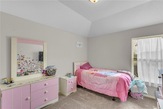 bedroom with light colored carpet and vaulted ceiling