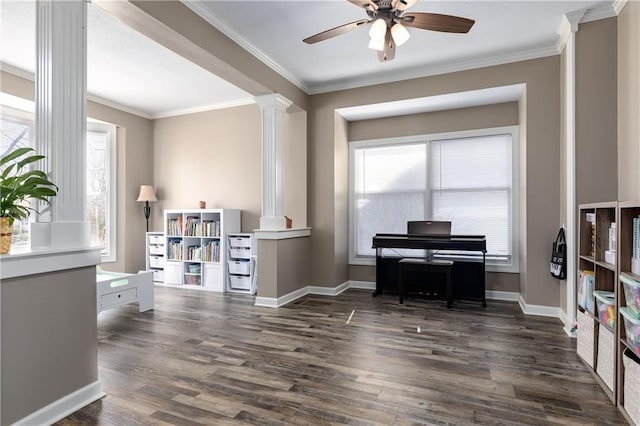 4200 Grand Ave, Leavenworth, KS 66048 - sitting room with decorative columns, ceiling fan, dark wood-style floors, and a healthy amount of sunlight