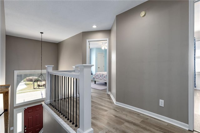 4200 Grand Ave, Leavenworth, KS 66048 - hallway featuring recessed lighting, baseboards, an upstairs landing, and wood finished floors