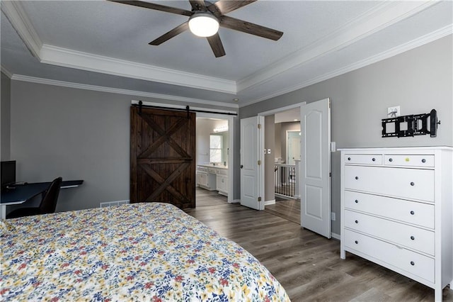 4200 Grand Ave, Leavenworth, KS 66048 - bedroom featuring ornamental molding, a raised ceiling, wood finished floors, and a barn door