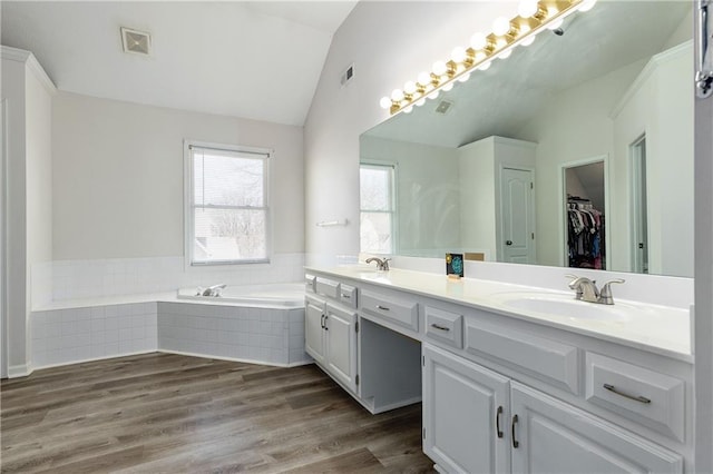 4200 Grand Ave, Leavenworth, KS 66048 - bathroom with visible vents, a sink, and lofted ceiling