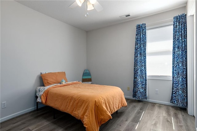 4200 Grand Ave, Leavenworth, KS 66048 - bedroom with visible vents, baseboards, ceiling fan, and wood finished floors