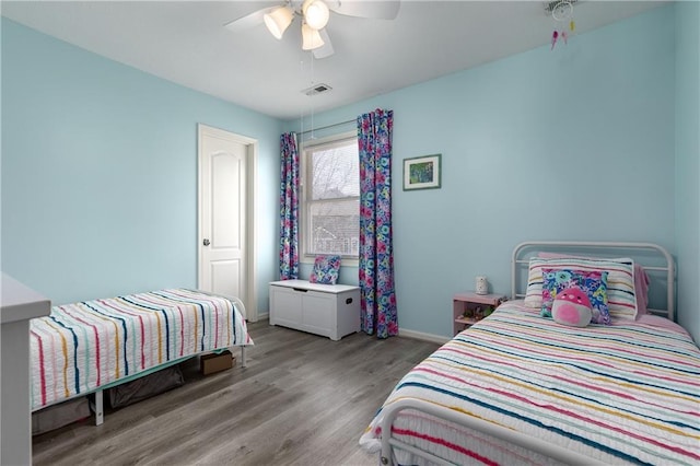4200 Grand Ave, Leavenworth, KS 66048 - bedroom with a ceiling fan, baseboards, visible vents, and wood finished floors