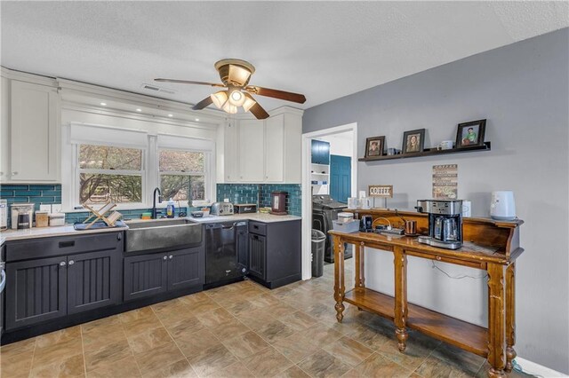 kitchen with a sink, a ceiling fan, black dishwasher, and white cabinets