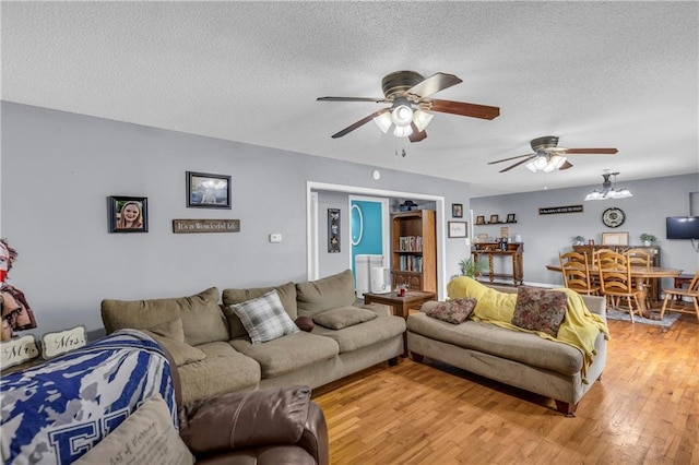 524 Truman St, Pomona, KS 66076 - living room featuring ceiling fan, a textured ceiling, and light wood-type flooring