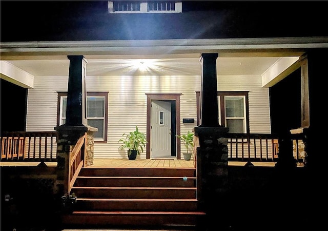 507 N Pearl St, Paola, KS 66071 - view of exterior entry featuring covered porch