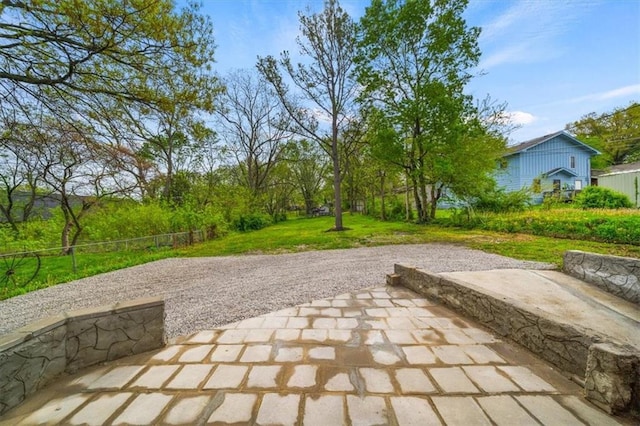 507 N Pearl St, Paola, KS 66071 - view of home's community with a lawn and a patio