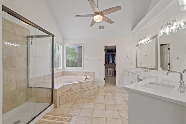 bathroom featuring a ceiling fan, a bath, visible vents, a shower stall, and a sink