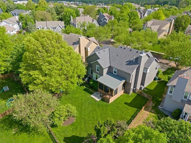birds eye view of property with a residential view