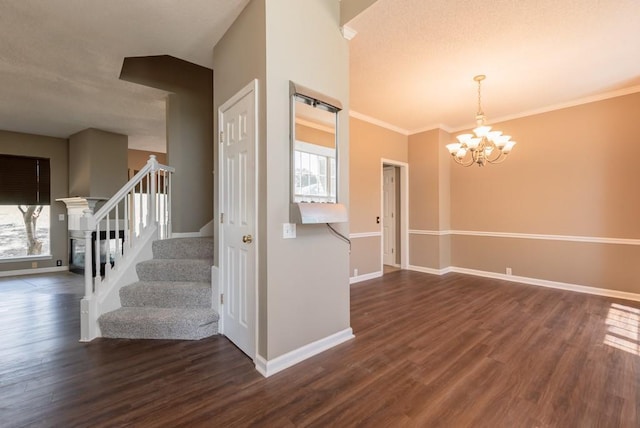 6512 N Fisk Ct, Kansas City, MO 64151 - stairs with a chandelier, wood finished floors, baseboards, and crown molding