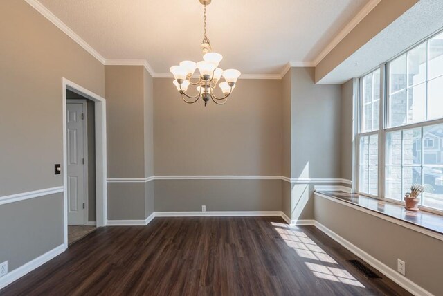 6512 N Fisk Ct, Kansas City, MO 64151 - unfurnished room featuring a chandelier, wood finished floors, ornamental molding, and baseboards